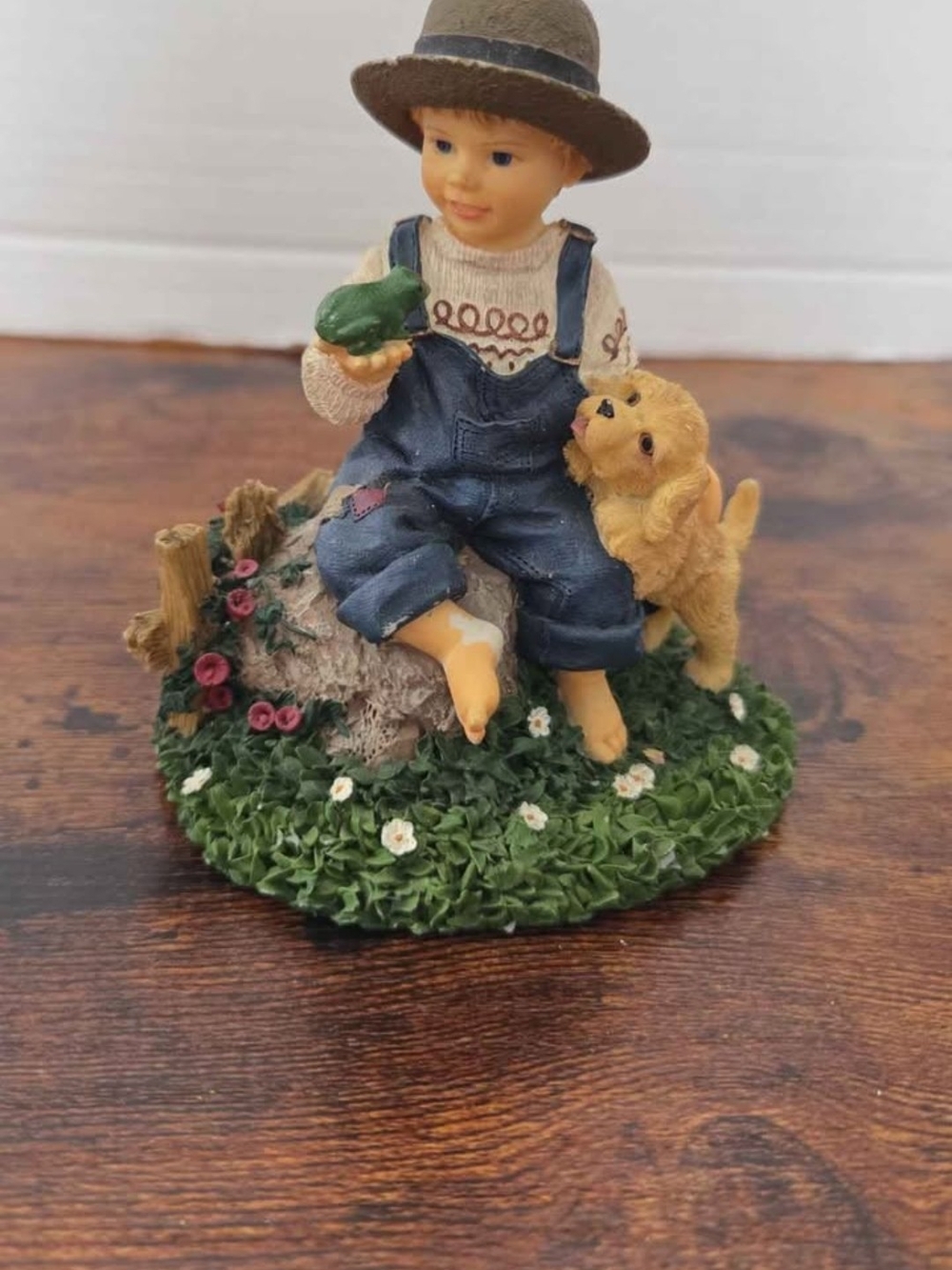 vintage resin collectible figurine featuring a country boy in denim overalls
